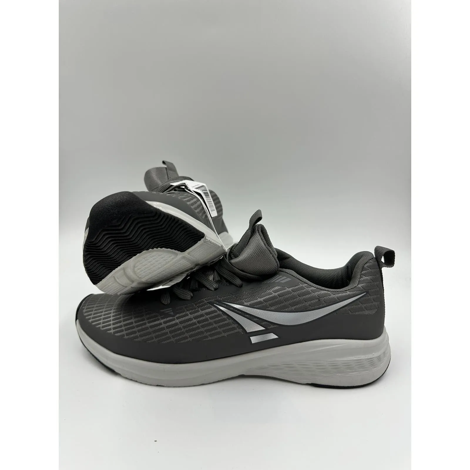 Men's Size 10, Gray Low Top Running Sneakers with White Soles and Running Tread